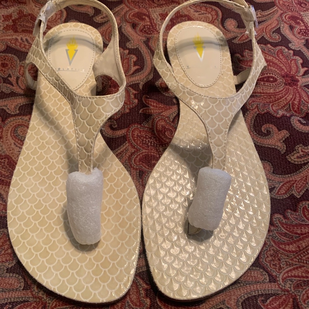 NWOT Volatile sandals w/ classic design of cream snakeskin. Buckles are wrapped